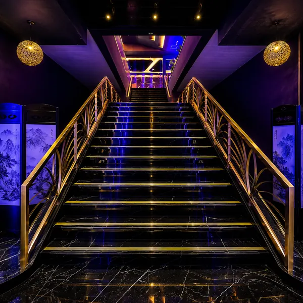 Blue-purple illuminated staircase corridor