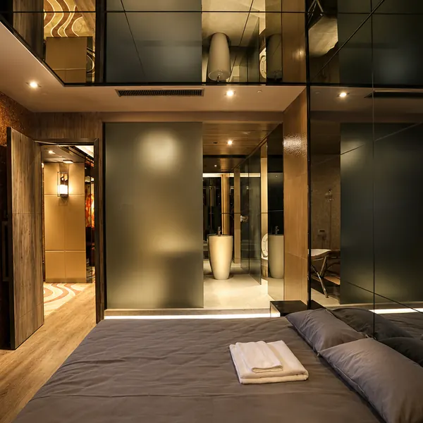 High-ceiling private suite with waterbed